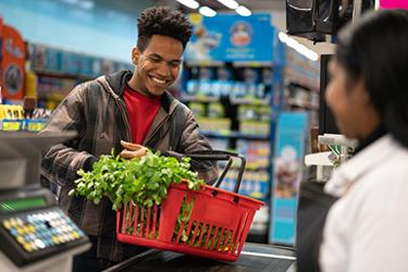 person checking out at grocery store